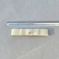Close-up of 8cm ivory satin double-layered bow with large pearl detail and measurement scale - Beige With Pearl (2)