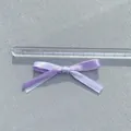 Detail of two-tone satin double bow for DIY hair accessories and gift box decoration - Double Layer Bow / Light Purple and White