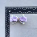 Detailed view of handmade floral bow accessory showing 8cm width with measurement ruler - Purple(4)