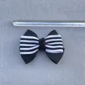 Detail view of 8.5cm black and white striped grosgrain bow with ruler for scale - Black And White Striped Double Bow (8)