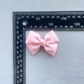 Pink ribbed ribbon bow hair accessory measured with a ruler showing 5cm width detail - Pink Handmade Grosgrain Knot Bow (6)