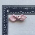 Grosgrain ribbon bow in dusty pink with star rhinestone showing 5.5cm width measurement - Dusty Rose