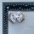 Detail view of plaid bow accessory with white lace and center pearl for DIY crafts - Brown and White Plaid