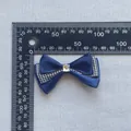 Close-up of a navy mesh bow hairclip with houndstooth ribbon and a square rhinestone - Navy Houndstooth Layered Style (5)