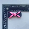 Handmade black and pink ribbon bow accessory with measurement scale for DIY projects - Pink/Black