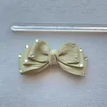 Macro view of a 10cm olive green ribbon bow hair clip with sparkling rhinestones - Olive Green