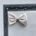 Detailed view of grey satin and white lace layered bow with size measurements shown - Gray