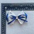 Detailed view of large navy blue mesh bow with lace and gem shown on a metric scale - Navy Lace Organza Patchwork Style (4)