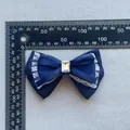 Detailed view of large dark blue mesh bow with white lace trim and crystal center - Navy Lace Trimmed Style (6)