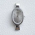 Elegant unisex silver stainless steel quartz watch with oval dial and sunray texture - Silver Sunburst Dial Silver Strap