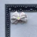 Detailed view of floral lace bow with strawberry resin accessory and scale measurement - Gray Strawberry Style (8)
