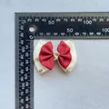 Detail view of handmade double-layer bow with heart rhinestone showing exact size dimensions - Red and White Textured Style (5)