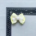 Detail shot of yellow layered bow accessory with resin rose and size measurement scale - Rose Double Layer Grosgrain Satin Bowknot (6)