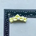 Pale yellow satin bow accessory with rhinestones and heart detail on blue background - Heart Rhinestone Decor Satin Bowknot (3)