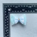 Macro view of light blue 3-layer mesh bow with star rhinestone and sequins accessory - Light Blue Bow (4)