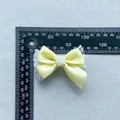 Detail of yellow silk ribbon bow with white lace base and resin rose for DIY crafts - Rose Lace Decor Satin Bowknot (4)