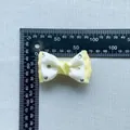 Detailed view of 45mm crystal rhinestone double-layer fabric bow accessory with scale ruler - Rhinestone Double Layer Craft Bowknot (5)