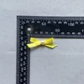 Yellow ribbon bow with white pearl centerpiece for cake decor and DIY crafts, 35mm wide - Yellow(1)