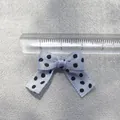 Close-up of light blue polka dot DIY bow accessory with ruler showing 3cm width scale - Light Blue
