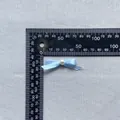 Detail of light blue ribbon bow with white pearl centerpiece measured on a ruler - Light Blue (6)