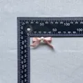 Macro shot of 30x20mm pink satin bow with faux pearl detail for cake and DIY decor - Bright Pink (10)