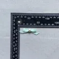 Detail of 40mm light blue satin bow with center pearl for DIY crafts and cake decor - Mint Green (14)