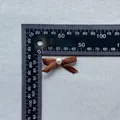 Brown satin bow ornament with white pearl center and 35mm measurement scale display - Brown (2)