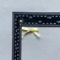 Detailed view of small light yellow ribbon bow with pearl core and size measurement - Light Yellow (4)
