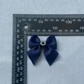 Macro shot of 5cm navy blue grosgrain ribbon bow with a center rhinestone embellishment - Navy Blue (Black Stone)