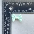 Close-up measurement of a 3cm mint green satin ribbon bow for DIY accessories - Mint Green(17)