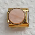Detail of Italian modular charm in gold finish with a pearly pink resin inlay - Gold Base Dusty Pink