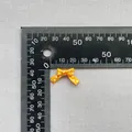 Detalle de un lazo de cinta naranja con lunares de 15 mm mostrado con regla de escala - Naranja con lunares blancos (5)
