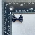 Detailed view of a 3cm black satin bow accessory measured with a precision scale ruler - Black(10)