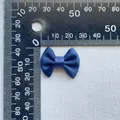 Macro detail of navy blue satin ribbon bow with measurement scale for size reference - Navy Blue (19)