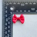 Detail view of a 3cm red satin bow showing material texture and size scale measurement - Red (20)