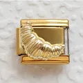 Macro view of a golden croissant-shaped Italian charm link made of polished stainless steel - Gold Mirror Croissant (18)