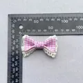 Detailed view of pink plaid bow accessory with white lace trim and 45mm measurement - Pink White Gingham With Lace