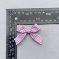 Pink gingham bow accessory for DIY crafts with 4.5cm width and 3.5cm height dimensions - Pink White Gingham Ribbon