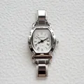 Orologio al quarzo argento a forma di botte con numeri romani e cinturino in metallo - Stile Tonneau Argento (ROSIVGA)