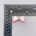 Detailed view of pink polka dot double-layer bow with ruler measurement 35mm wide - Pink Base White Polka Dot (4)