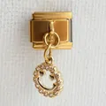 Macro detail of Italian charm bracelet link featuring a gold heart-eye smiley face with crystals - Smiley Face