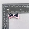 Detail view of a 35mm double-layer polka dot bow with ruler measuring dimensions - Pink Black Double Layer Polka Dot (69)