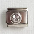 Close-up of Italian charm link with round clear crystal on stainless steel base - Clear