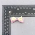 Detail shot showing a 4cm double-layer polka dot bow accessory next to a ruler scale - Pink Yellow Satin Bow (72)