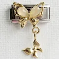 Macro shot of Italian charm bracelet link with gold double butterfly pendant and gems - Double Butterfly Gold Butterfly Silver Style