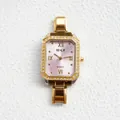 Detail of a rectangular gold-tone watch with a crystal bezel and pink sunray dial - Pink
