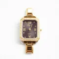 Detailed close-up of square gold quartz watch with diamond bezel and Roman numerals - Black