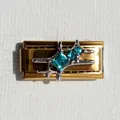 Macro detail of Italian charm link featuring gold plating and turquoise star stone inlay - Blue Zirconia Star Gold