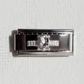 Macro di un charm in argento lucido con incisione a stella e dettaglio in cristallo - Zirconia Ovale Argento Tipo 2