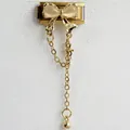 Detailed view of Italian charm link featuring a golden butterfly and dangling chains - Gold Zirconia Gold Chain Gold Style